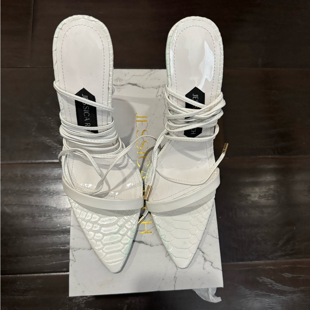 White stiletto sandals.